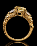 One-of-a-kind custom gold engagement ring with yellow diamond and two birds, handmade in Dublin